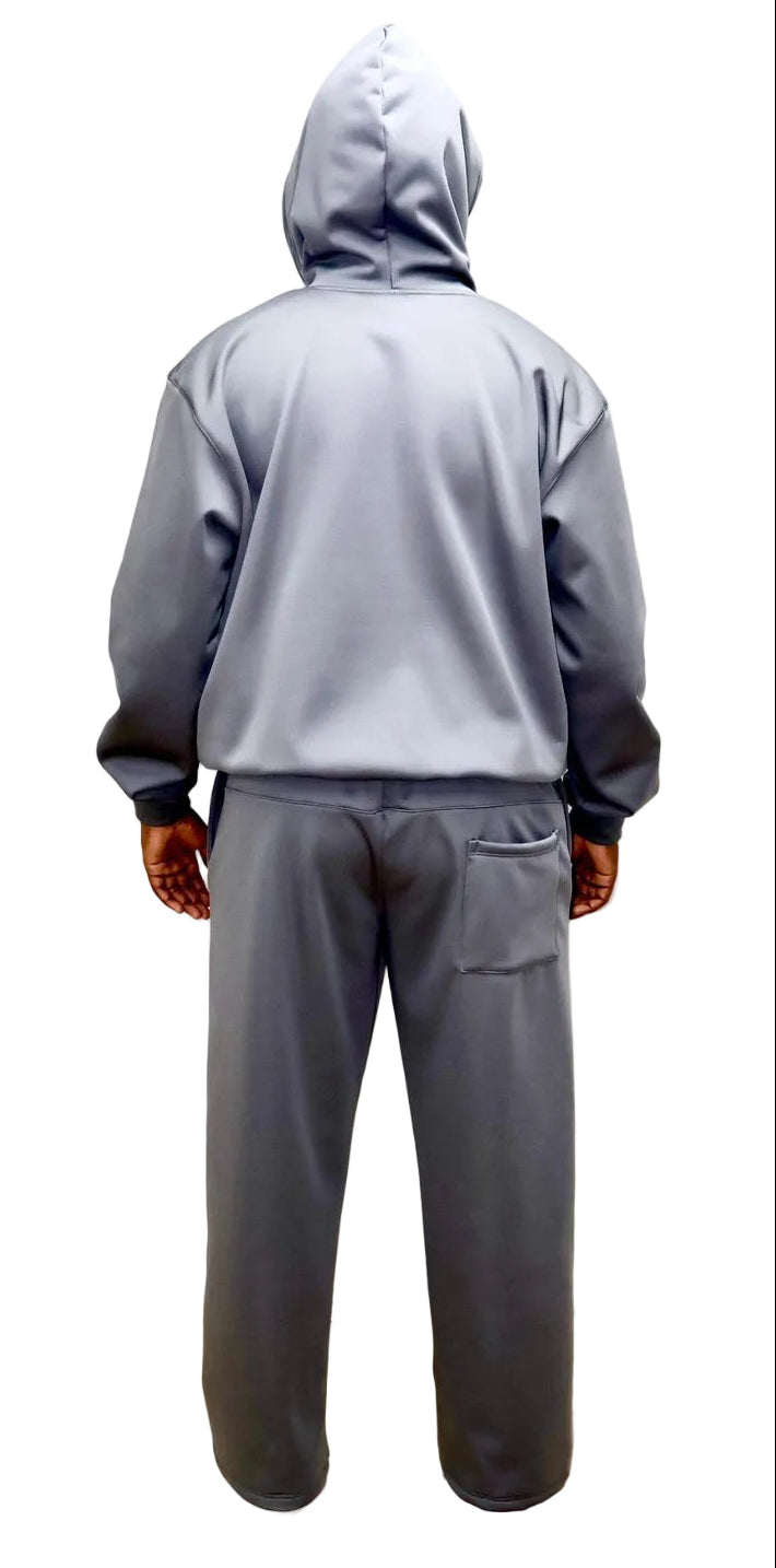 Person wearing a gray hoodie and pants on a white background
